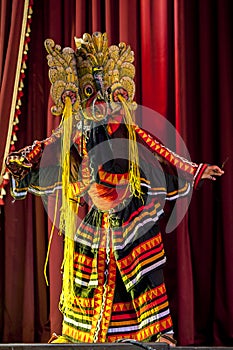 A colourfully costumed Mask Dancer performs at the Esala Perahara theatre show in Kandy, Sri Lanka.