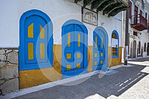 The colourfully decorated front of a building facing onto the harbour on the Greek island of Kastellorizo.