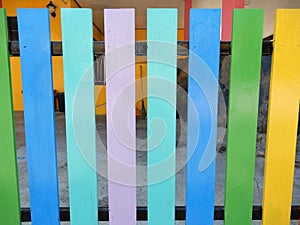 Colourfully painted fence