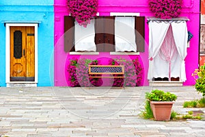 Colourfully painted house facade on Burano island photo