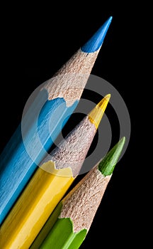 Colouring crayon pencils isolated on black background. Close up.