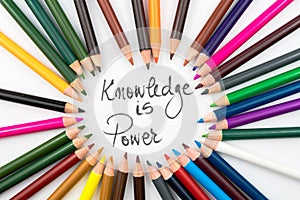 Colouring pencils in circle arrangement with message Knowledge Is Power