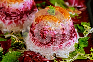 Colrful beetroot salad with herring and vegetable