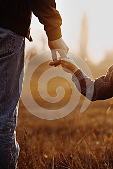 Colse up view of father and son hands