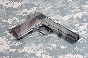 Colt 1911 handgun on uniform