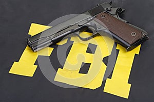 Colt m1911 handgun on fbi uniform photo