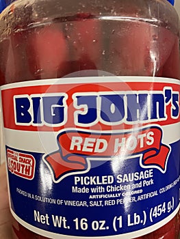 Big Johns Red hots sausage in a jar on a shelf