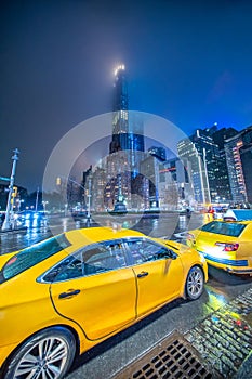 Columbus Circle skyscrapers and taxi cabs at night, Midtown Manhattan - New York City