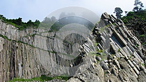 Column basalts formation of Stolbchaty cape at Kunashir, kuril islands, Russia