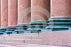 Column of brown marble on the facade of the building.