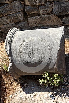 Column engraved with ancient Greek inscriptions. Ephesus ruins, Izmir.