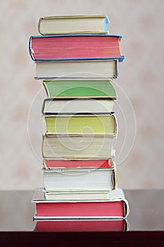 A column of hardback colorful closed books