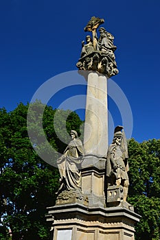 Column of The Holy trinity with statue of Vigin Mary and Saint Florian, built in year 1900 in Holic, western Slovakia
