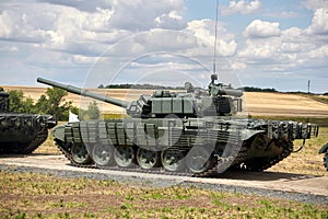 A column of modern military tanks