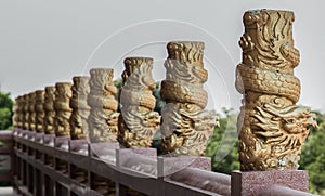 Column pillar at oriental golden hand rail on corridor in Chinese-style temple