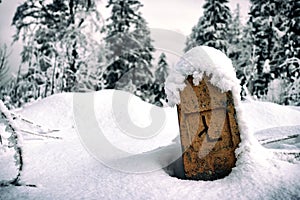 Column sign covered with snow