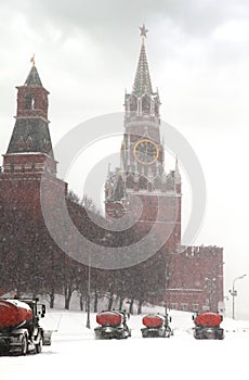 Column of snow-remover trucks on road near Kremlin