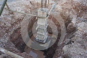 Column timber formwork and reinforcement bar at the construction site. the structure is supported by temporary wood support.