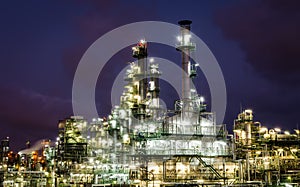 Column tower in petrochemical plant at twilight