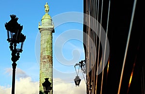 VendÃÂ´me column monument Paris with faÃÂ§ades at sunset Low angle shot photo