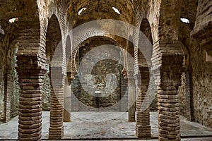 Columns in the ancient Arab baths in Ronda, Andalusia, Spain photo