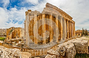 Columns of ancient Roman temple of Bacchus with surrounding ruin