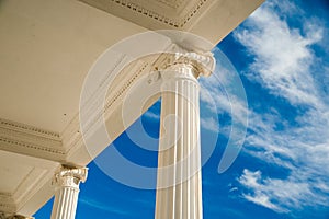 Columns on blue sky background.