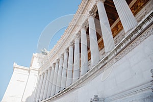 Columns of building on Venice Square in Rome Italy, blue sky