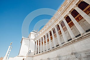 Columns of building on Venice Square in Rome Italy, blue sky