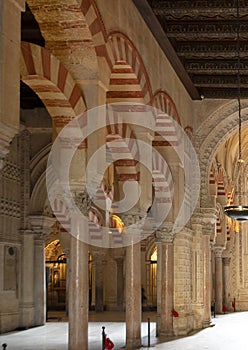 Columns and double-tiered arches of the Mosque-Cathedral of Cordoba in the Spanish region of Andalusia, Spain.