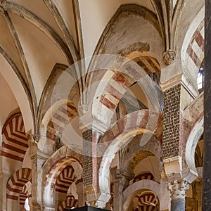 Columns and double-tiered arches of the Mosque-Cathedral of Cordoba in the Spanish region of Andalusia, Spain.