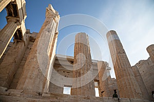 Columns of entrance propylaea to ancient temple Parthenon in Acropolis Athens Greece on blue sky background