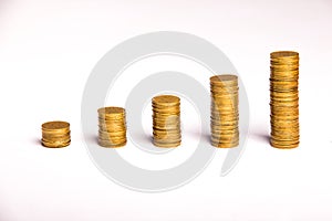 Columns of gold coins in ascending values