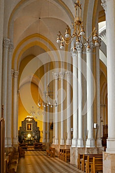 Columns of Gothic vaults and divine light at the end
