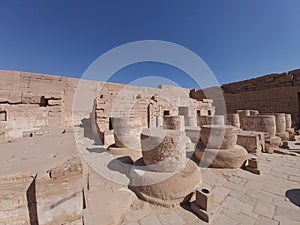 Columns with hieroglyphic carvings at ancient Egyptian temple of Medinat Habu in Luxor