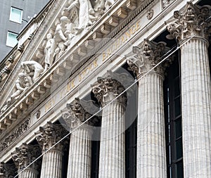 Columns and inscription under the bas-relief on the facade of the New York Stock Exchange on Wall Street