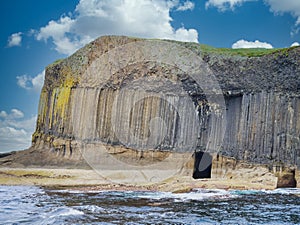 Columns of jointed volcanic basalt rocks on the island of Staffa in the Inner Hebrides, Scotland