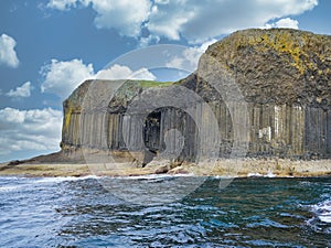 Columns of jointed volcanic basalt rocks on the island of Staffa in the Inner Hebrides, Scotland