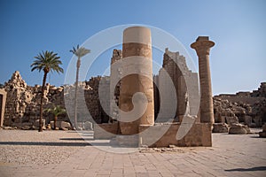 Columns and statues in ancient of Amun-Ra. Temple of Karnak in Luxor - Ruined Thebes Egypt