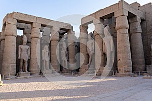 Columns and statues in the courtyard of Ramses II of the Luxor Temple