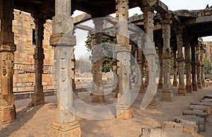 Columns with stone carving in courtyard of Quwwat-Ul-Islam mosque, Qutab Minar complex, Delhi