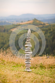 Columns of stones carefully balanced one on top of the other, displaying a sense of calm and concentration