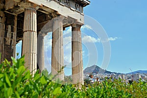 Columns of the Temple of Hephaestus with view of Athens in the background