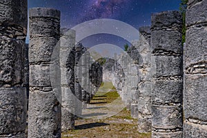 Columns of the Thousand Warriors in Chichen Itza, Mexico with Milky Way Galaxy stars night sky