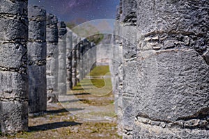 Columns of the Thousand Warriors in Chichen Itza, Mexico with Milky Way Galaxy stars night sky