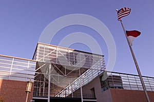 The Colvard building at UNC Charlotte with an American and North Carolina Flag photo