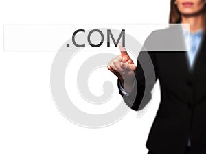 .COM - Businesswoman hand pressing button on touch screen interface.