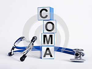 Coma word on medical cubes on white background