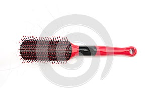 Comb with shreds of hair on a white background
