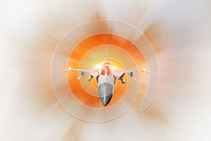 Combat fighter jet on a military mission with weapons - rockets, bombs, weapons on wings, at high speed with fire afterburner